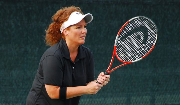 Tammi Montgomery playing tennis on a court in The Villages, Florida